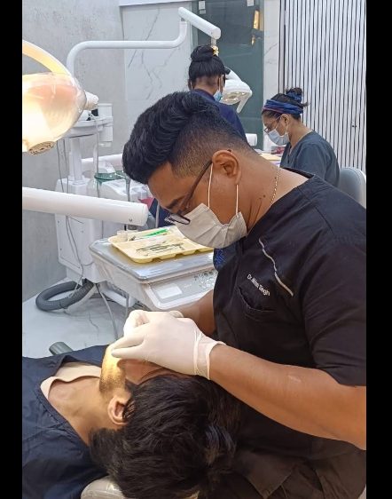 Dr. Nishant Singh treating a patient in the clinic